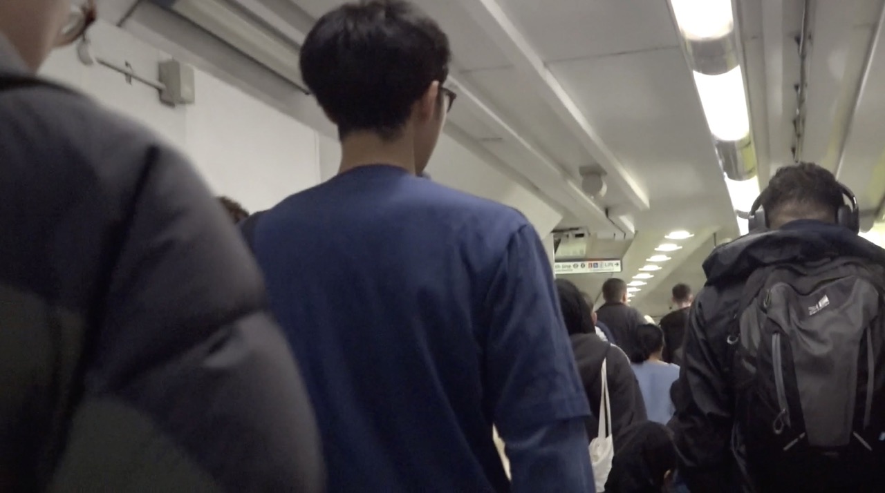 Commuters walking through an underground station